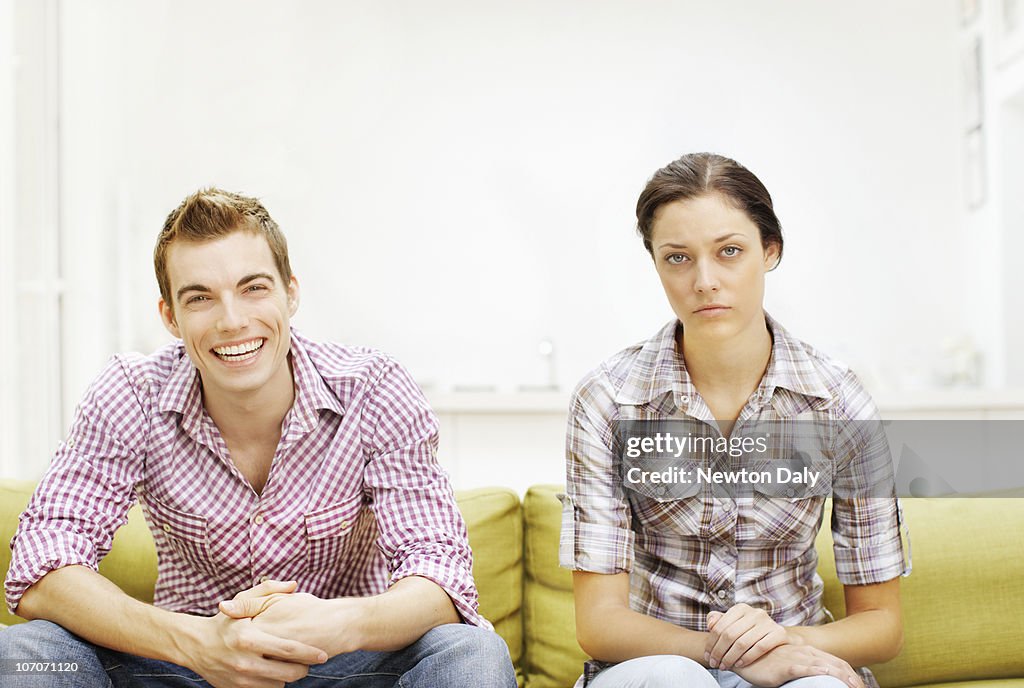 Couple sitting on sofa