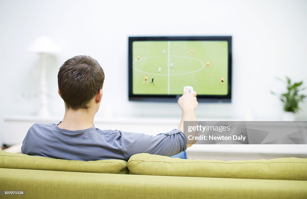 Man watching football on television              