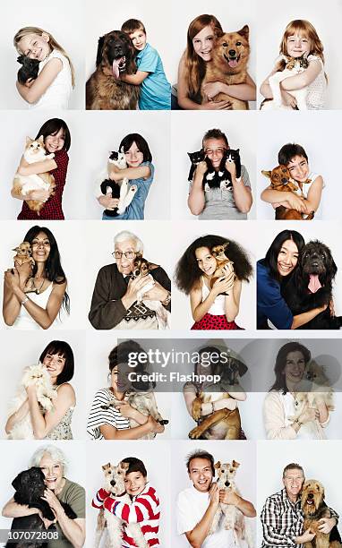 group of people hugging their pets - große tiergruppe stock-fotos und bilder