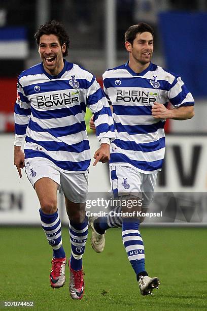 Olcay Sahal of Duisburg celebrates the first goal with Olivier Veigneau of Duisburg during the Second Bundesliga match between MSV Duisburg and FC...