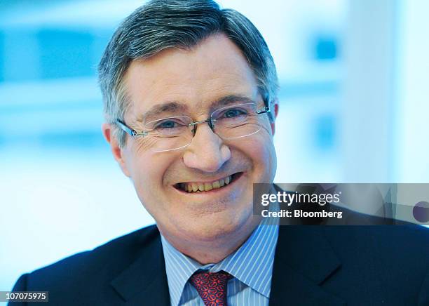 Glenn Britt, chairman, president and chief executive officer of Time Warner Cable Inc., smiles during an interview in New York, U.S., on Monday, Nov....