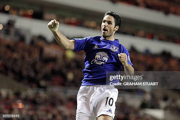 Everton's Spanish midfielder Mikel Arteta celebrates scoring against Sunderland during an English FA Premier League football match at the Stadium of...