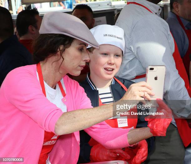 Minnie Driver and son Henry Story Driver attend the Los Angeles Mission Thanksgiving event for the homeless at the Los Angeles Mission on November...
