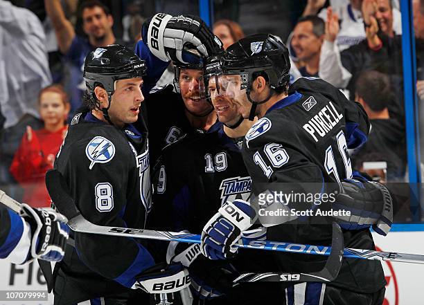 Teddy Purcell of the Tampa Bay Lightning celebrates his goal with teammates Randy Jones, Dominic Moore and Ryan Malone during the second period...