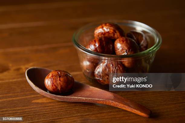 candied chestnuts - chestnut stock pictures, royalty-free photos & images