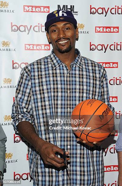 Lakers basketball player Ron Artest cuts the ribbon at the Bay Cities Kitchens Grand Opening at Bay Cities Kitchens and Appliances on November 22,...