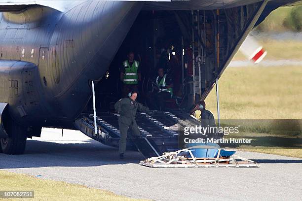 An RNZAF Hercules delivers a ventilation fan on the runway at the Greymouth Airport to be taken to the Pike River mine on November 23, 2010 in...