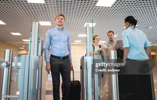 male traveler at the airport going to the gate - airport security stock pictures, royalty-free photos & images