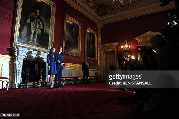 Britain's Prince William and his fiancée Kate Middleton pose for photographers during a photocall to mark their engagement, in the State Rooms of St...
