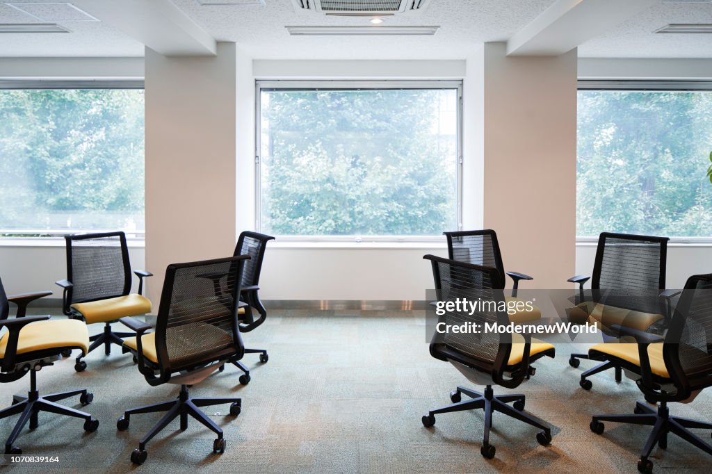 The 2 group of chairs by the window in the convention room