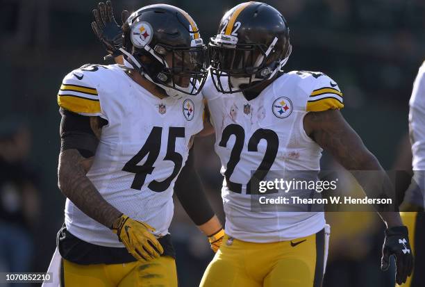 Stevan Ridley and Roosevelt Nix-Jones of the Pittsburgh Steelers celebrates after Ridley scored a touchdown against the Oakland Raiders during the...