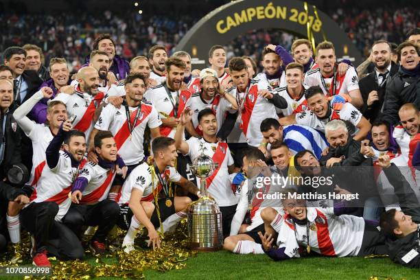 The River Plate team celebrate with the Copa Libertadores Trophy following their victory in the second leg of the final match of Copa CONMEBOL...