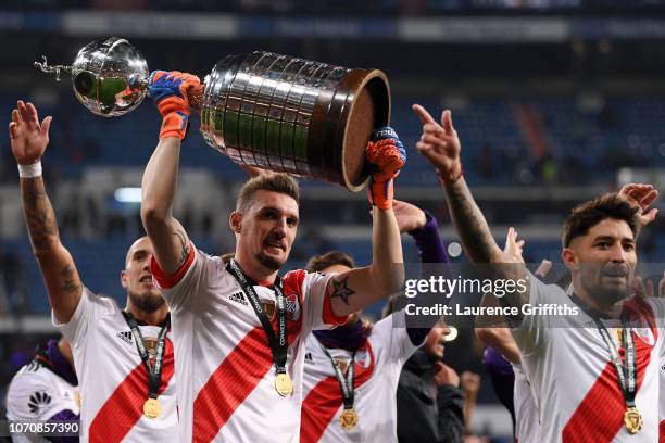 Franco Armani of River Plate celebrates with the Copa Libertadores Trophy following his sides victory in the second leg of the final match of Copa...
