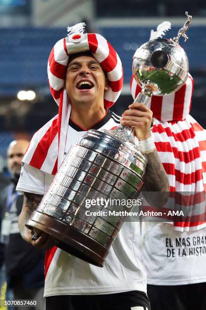 Enzo Perez of River Plate celebrates with the trophy at the end of the second leg of the final match of Copa CONMEBOL Libertadores 2018 between Boca...