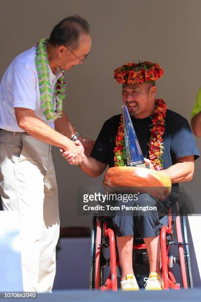 Masazumi Soejima, 1st place winner of mens wheel chair, get the prize during the Honolulu Marathon 2018 on December 9, 2018 in Honolulu, Hawaii.