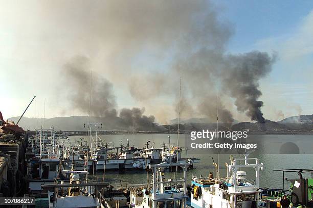 In this image provided by a local resident, Smoke rises from South Korea's Yeonpyeong island near the border against North Korea on November 23, 2010...