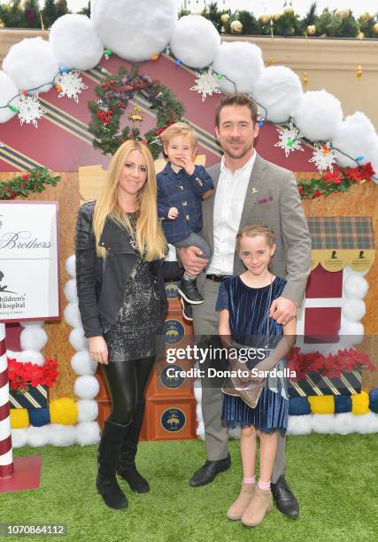 Katy O'Grady and Barry Sloane with family attend the Brooks Brothers and St Jude Children's Research Hospital Annual Holiday Celebration at the...