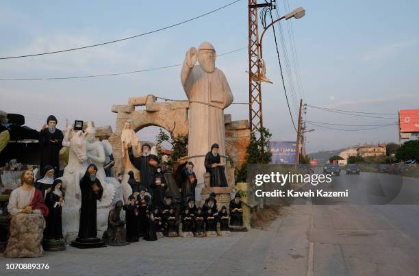 Statues of Jesus, Christian Maronite Saints on display outside a manufacturer"u2019s workshop by the roadside on April 28 , 2018 in Qadisha Valley,...