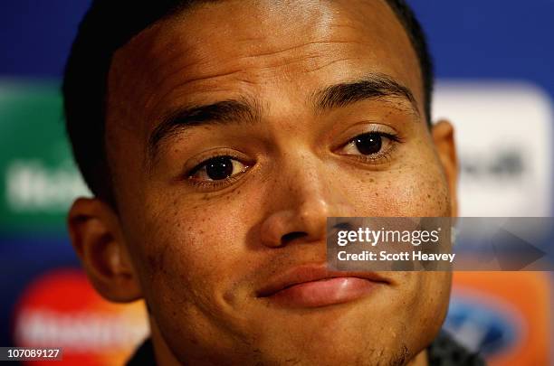 Jermiane Jenas of Tottenham talks to the media during a press conference to preview the UEFA Champions League group A match against Werder Bremen on...