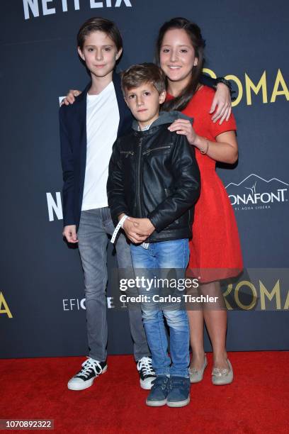 Carlos Peralta, Marco Graf and Daniela Demesa poses for photos during the red carpet and screening of the Alfonso Cuaron and Netflix film 'Roma' at...