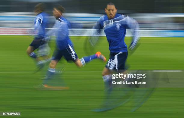 Jermaine Jones sprints during a FC Schalke 04 training session ahead of the UEFA Champions League match against Olympique Lyon at Schalke 04 training...