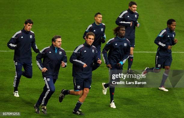 Head coach Claude Puel warms up with his players during a Olympique Lyon training session ahead of the UEFA Champions League match against FC Schalke...