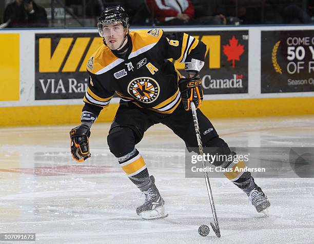 Eric Gudbranson of the Kingston Frontenacs skates with the puck in a game against the London Knights on November 21, 2010 at the John Labatt Centre...