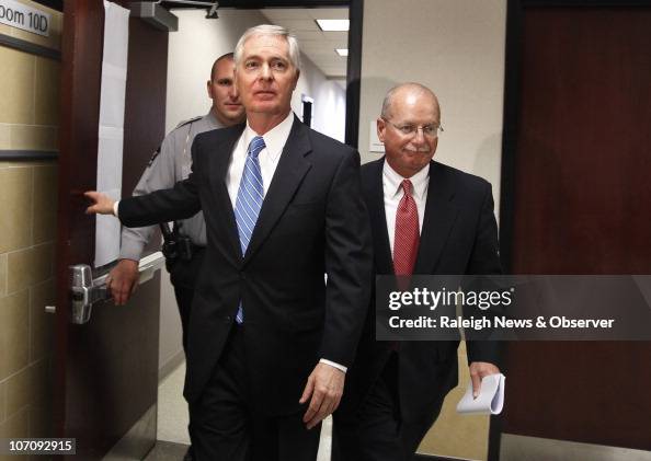 Mike Rasley Former Gov. Mike Easley walks with attorney Rick Gammon, right, as he ...