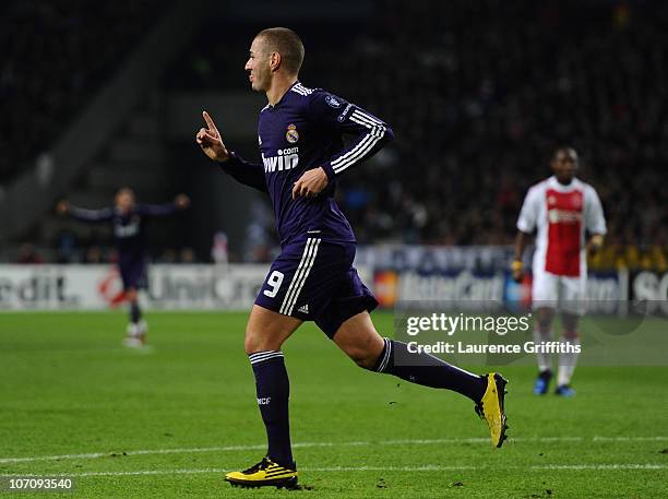 Karim Benzema of Real Madrid celebrates his first half goal during the UEFA Champions League Group G match between AFC Ajax and Real Madrid at the...