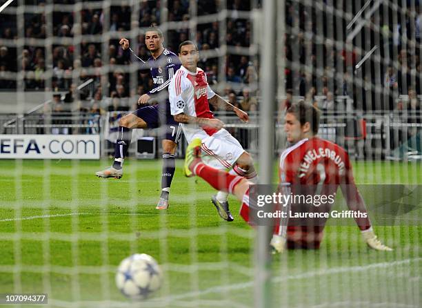 Cristiano Ronaldo of Real Madrid fires home the third goal past Maarten Stekelenburg of Ajax during the UEFA Champions League Group G match between...