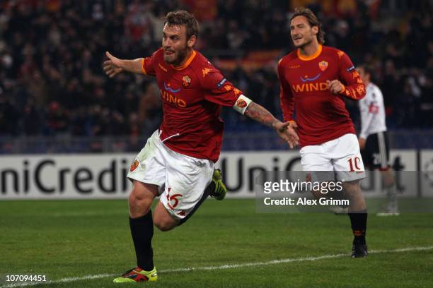 Daniele de Rossi of Roma celebrates his team's second goal with team mate Francesco Totti during the UEFA Champions League group E match between AS...