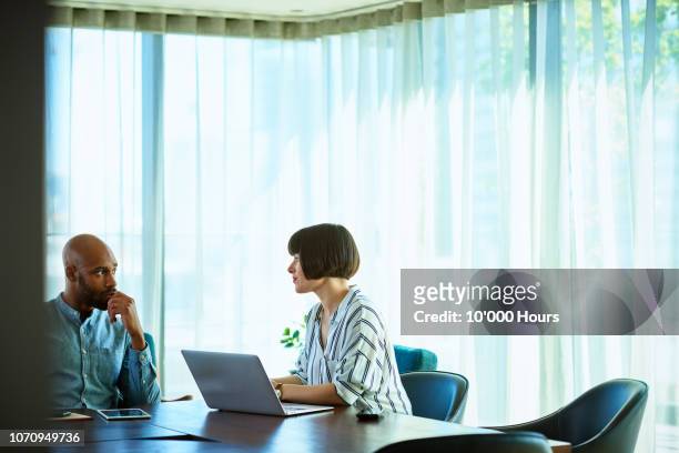 serious discussion between two business colleagues in office - job interview nervous stock pictures, royalty-free photos & images