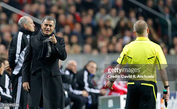 Real Madrid coach Jose Mourinho talks to referee's assistant during the UEFA Champions League Group G match between Ajax Amsterdam and Real Madrid at...
