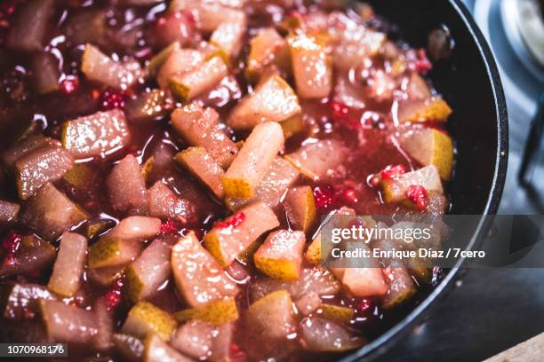 pink pear crumble filing on the stove - cobbler stock pictures, royalty-free photos & images