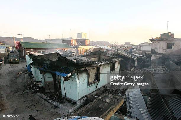 In this image provided by a local resident, Destroyed houses are seen on Yeonpyeong Island, South Korea, following artillery exchange between North...