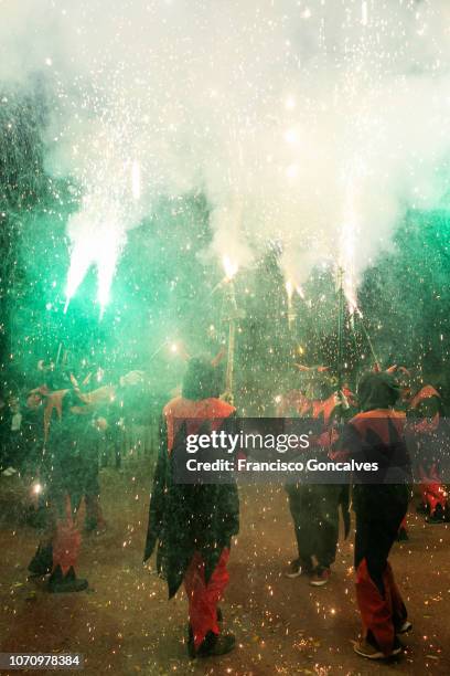 correfocs dancing with fireworks in barcelona - correfoc stock pictures, royalty-free photos & images