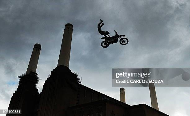 Competitor, Mike Mason, takes part in a practice session of the Red Bull X-Fighters motocross championships in front of London's iconic Battersea...