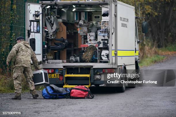 Bomb disposal experts and police forensic scientists work at the scene, of a controlled explosion on a suspicous device on November 22, 2018 in...