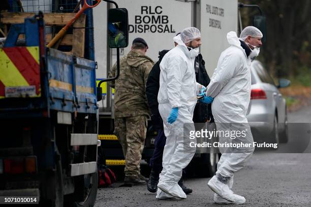 Bomb disposal experts and police forensic scientists work at the scene, of a controlled explosion on a suspicous device on November 22, 2018 in...
