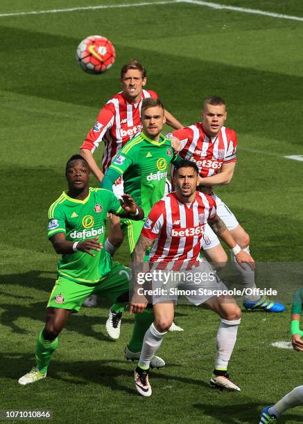 30th April 2016 - Barclays Premier League - Stoke City v Sunderland - Geoff Cameron of Stoke and Lamine Kone of Sunderland watch the ball as it...
