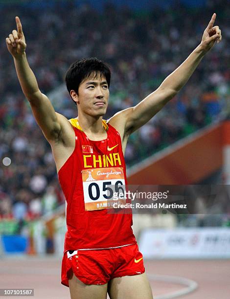 Liu Xiang of China wins the gold medal in the Men's 110m Hurdles at Aoti Main Stadium during day twelve of the 16th Asian Games Guangzhou 2010 on...