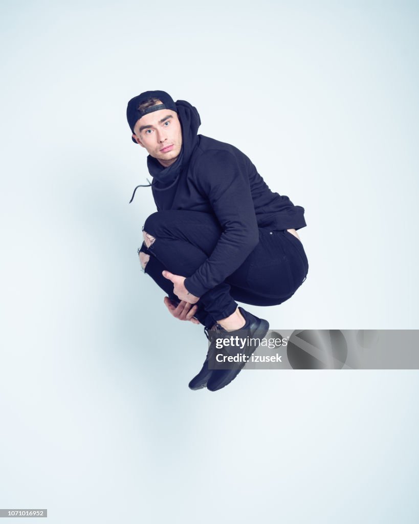 Guy Jumping While Rapping Portrait Of Hip Hop Guy Jumping In The Air High-Res Stock Photo - Getty ...