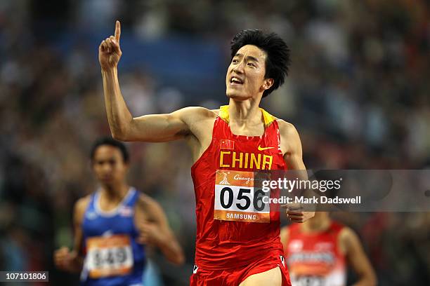 Liu Xiang of China wins the gold medal in the Men's 110m Hurdles at Aoti Main Stadium during day twelve of the 16th Asian Games Guangzhou 2010 on...