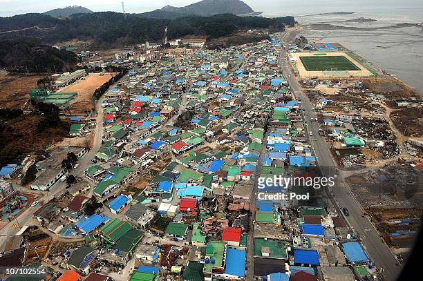 Destroyed houses are seen on Yeonpyeong Island, South Korea, following artillery exchange between North and South Korea on November 24, 2010 in...