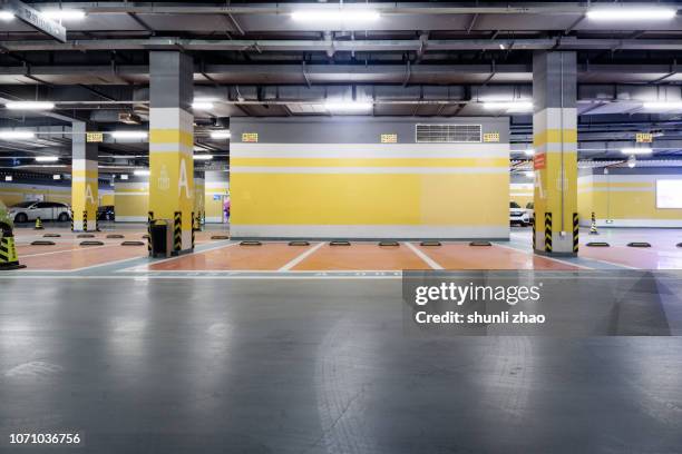 underground parking lot - parking garage stock-fotos und bilder