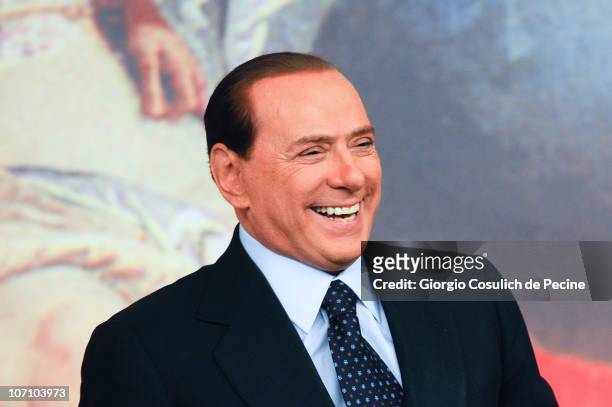 Italian Prime Minister Silvio Berlusconi smiles during a press conference to present new government measures for the youngsters, called 'Right To The...