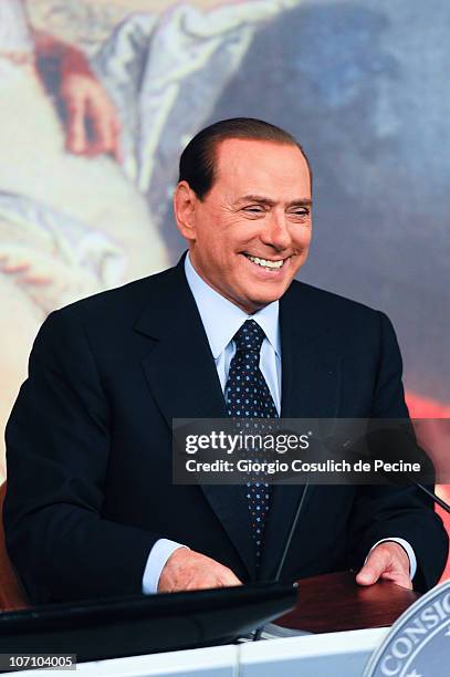 Italian Prime Minister Silvio Berlusconi smiles during a press conference to present new government measures for the youngsters, called 'Right To The...