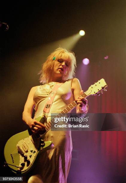 American singer and guitarist Courtney Love performs live on stage with the rock group Hole at Brixton Academy in London on 4th May 1995.