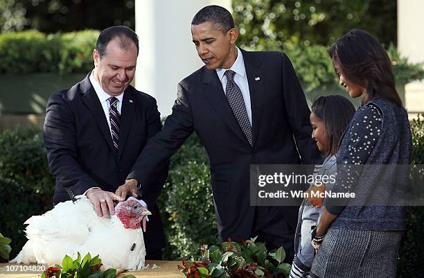 President Barack Obama pardons the National Thanksgiving Turkey, named Apple, in a ceremony with daughters Sasha and Malia and National Turkey...