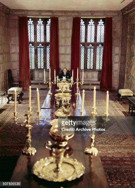 American industrialist J. Paul Getty in the dining room of Sutton Place, his Tudor manor house in Surrey, circa 1960.